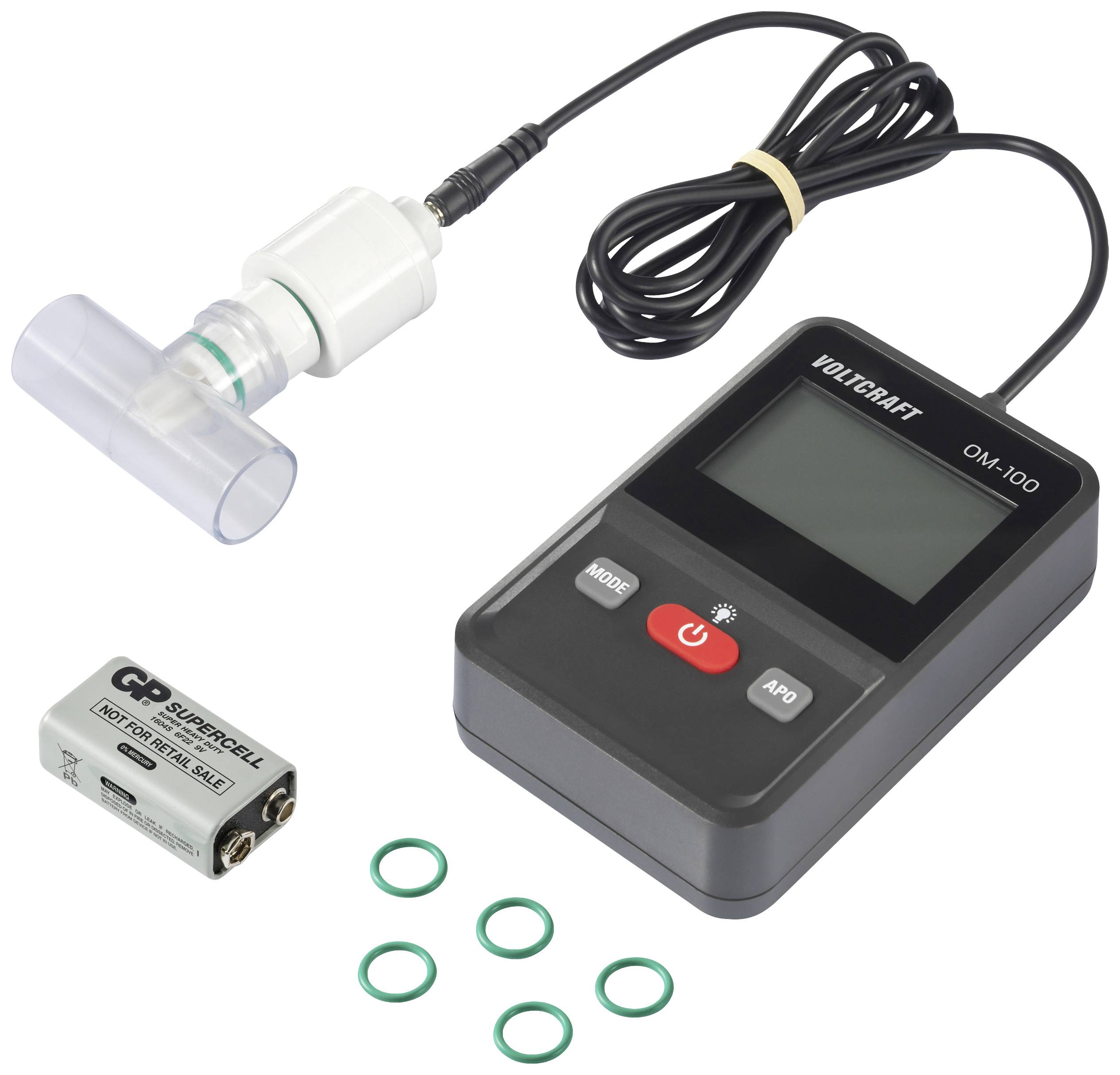 Elektronické zariadenie s displejom a tlačidlami, prepojené s dychovým senzorom. Vedľa leží batéria a niekoľko zelených tesniacich krúžkov.