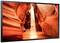 Obrázok zachytáva Antelope Canyon s jasne červenými skalnými stenami a svetelným lúčom, ktorý preniká zhora do kaňonu.