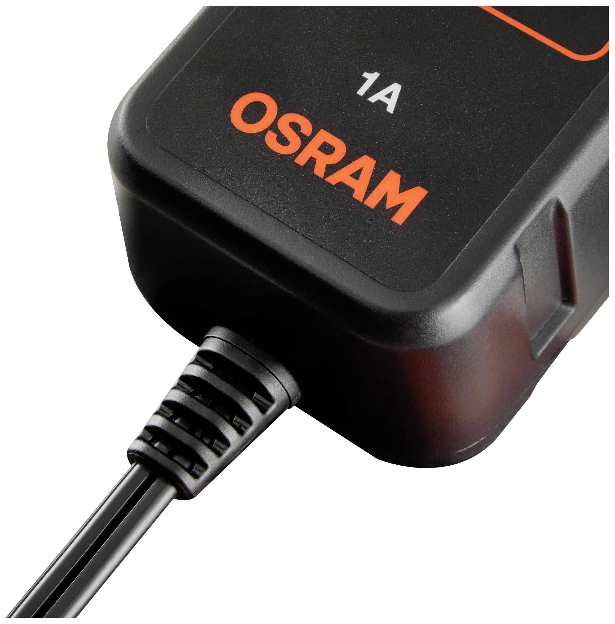 Čierna nabíjačka OSRAM s oranžovým textom leží na povrchu. Kábel je k nej pripojený.