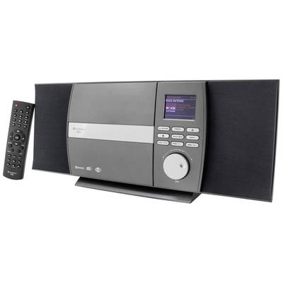 Stereo zostava s reproduktormi, veľkým ovládačom hlasitosti, obrazovkou s hudobnými informáciami. Vedľa položený diaľkový ovládač.