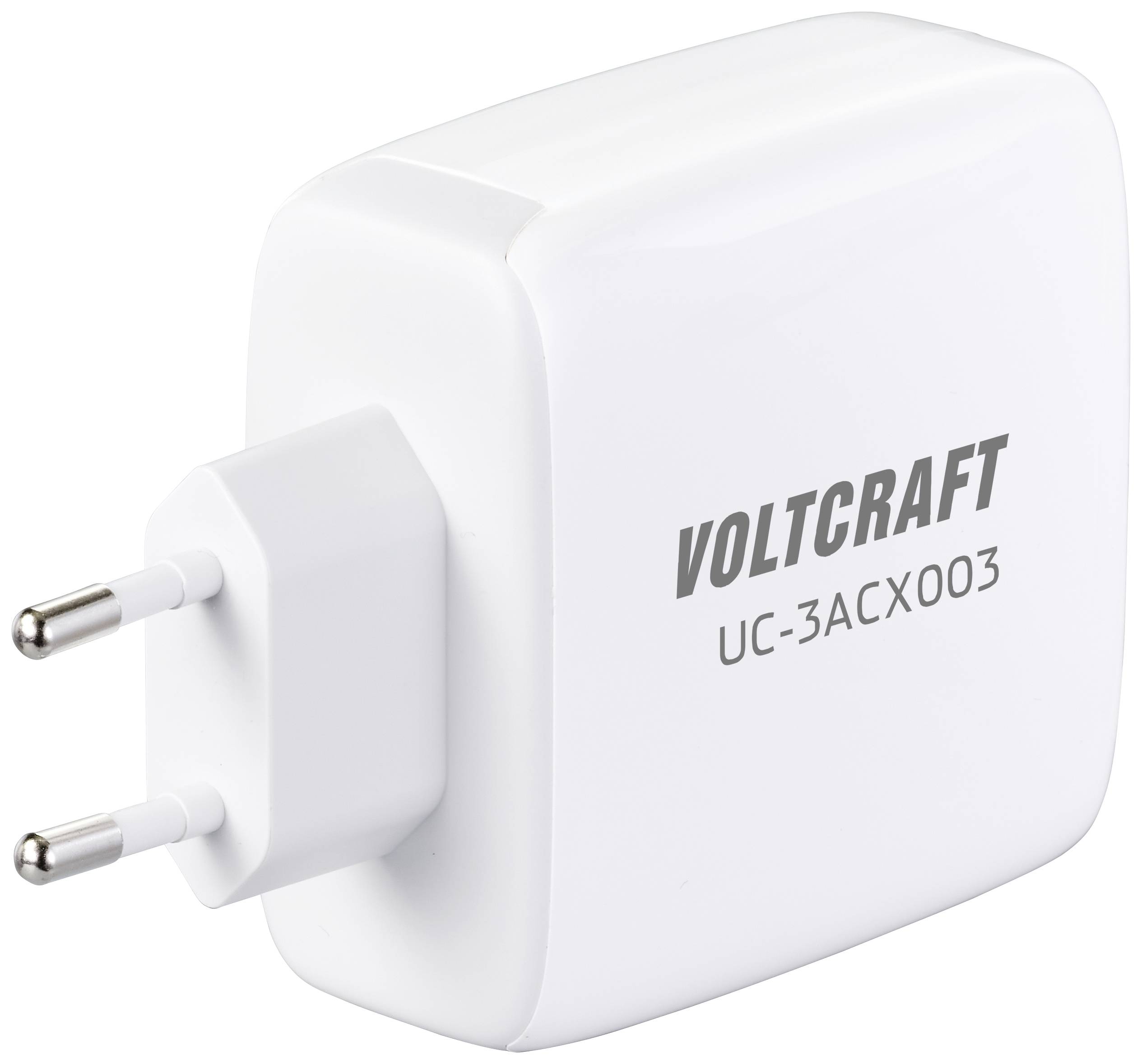 Biely napájací zdroj značky Voltcraft, model UC-3ACX003, s dvoma kovovými kolíkmi na pripojenie do elektrickej zásuvky.