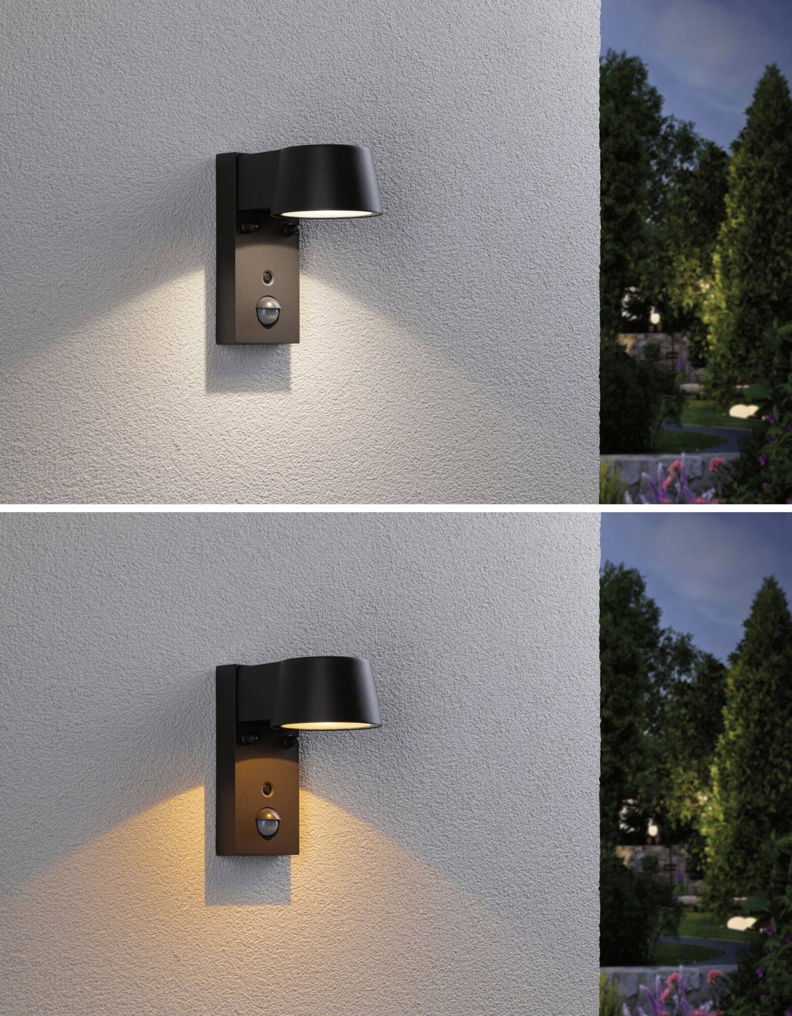 Vonkajšie svetlo na stene, ktoré svieti v dvoch farbách: hore biele, dole oranžové. V pozadí je vidieť záhradnú krajinu za súmraku.