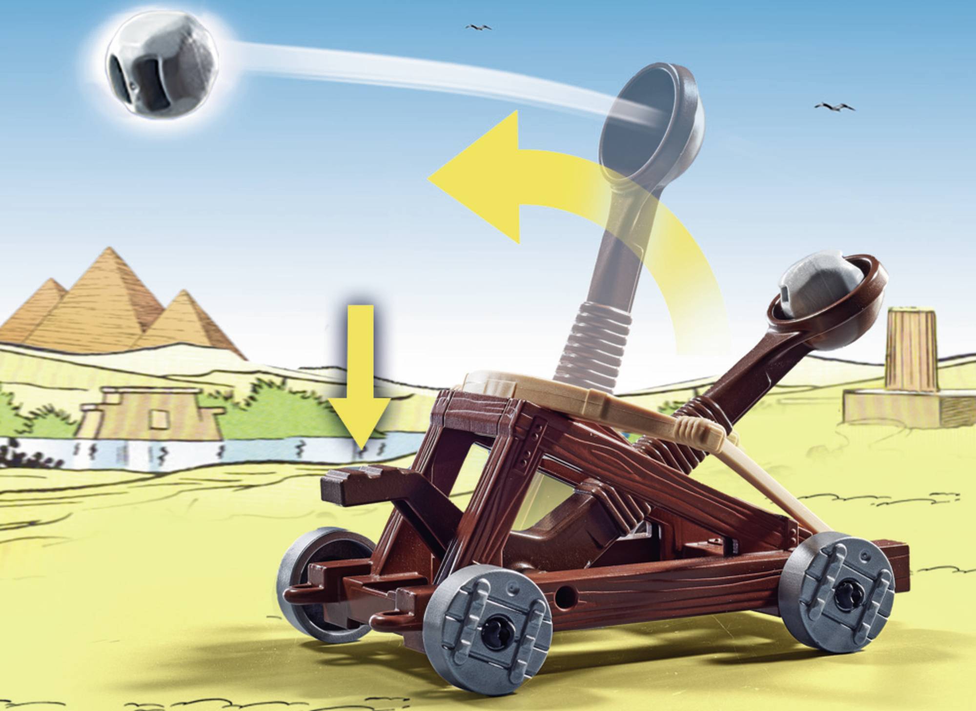 Katapultový model zo stavebných kociek; v akcii vymršťuje guľu. V pozadí sú pyramídy v púštnej krajine.