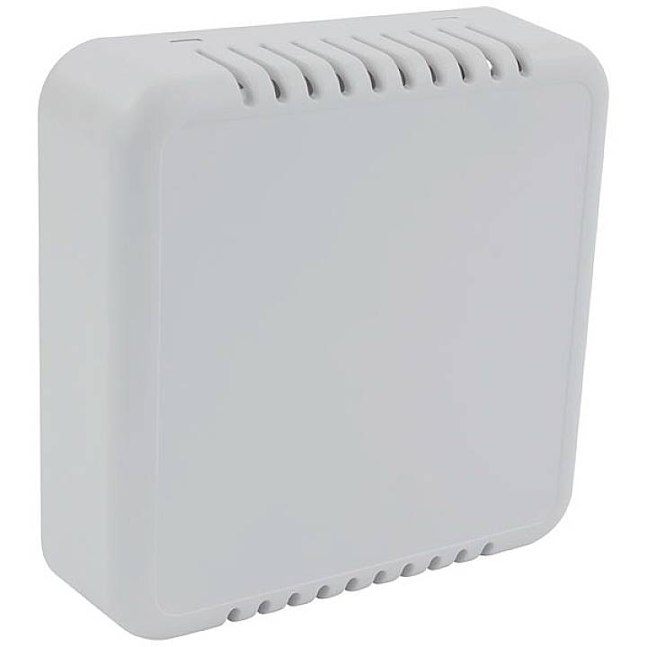 Obdĺžnikový, biely kryt s dierovaným povrchom. Vyzerá to ako technické zariadenie, pravdepodobne senzor alebo router.