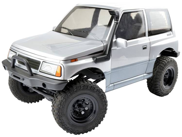 Strieborný model auta SUV s veľkými terénnymi pneumatikami, masívnym dizajnom a čiernymi rámikmi okien.