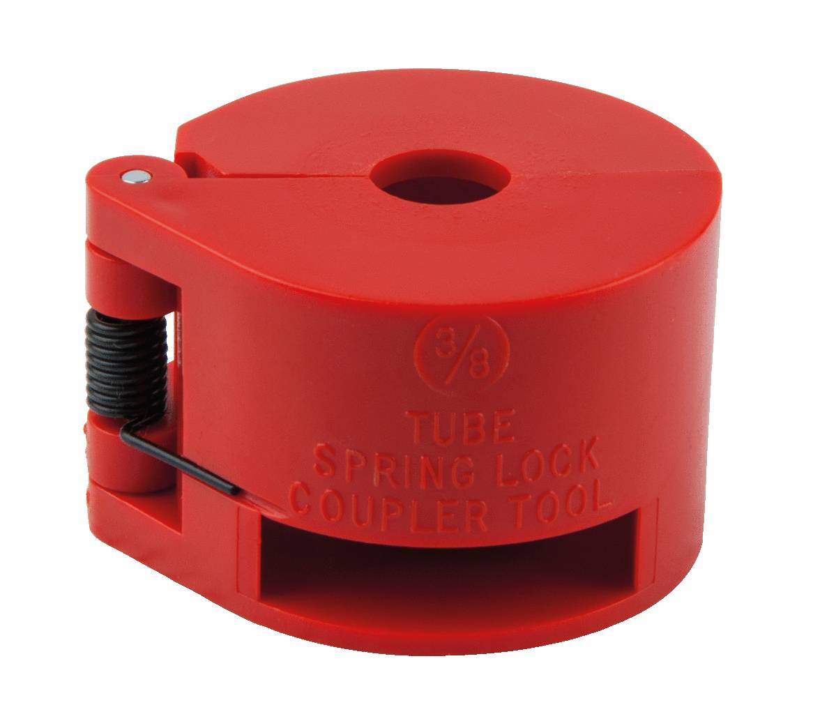 Červený plastový nástroj s nápisom 'Tube Spring Lock Coupler Tool'. Slúži na otváranie potrubných spojov.