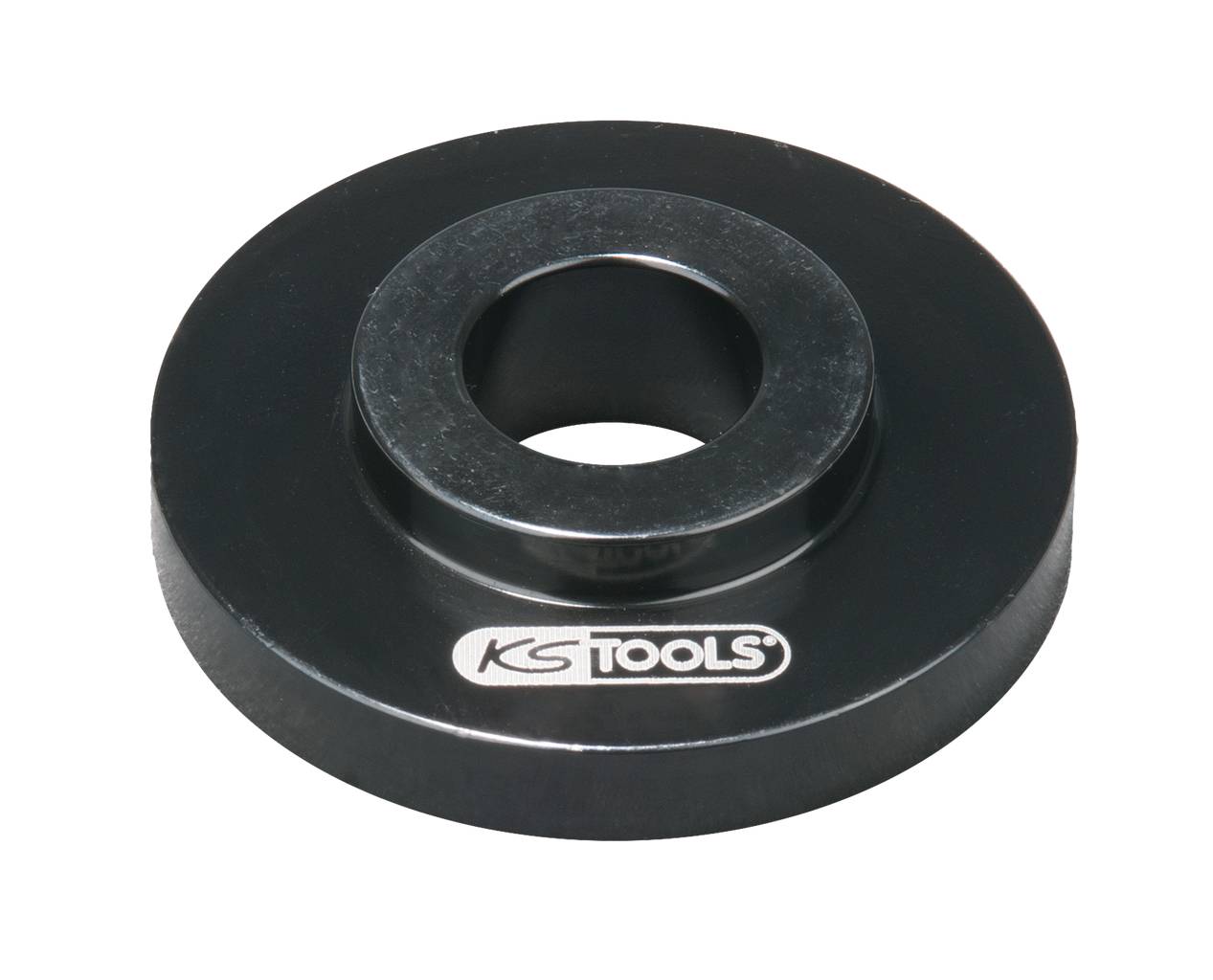 Okrúhla súčasť nástroja z čierneho kovu so stredovým otvorom a logom 'KS TOOLS', pravdepodobne podložka alebo medzikus.