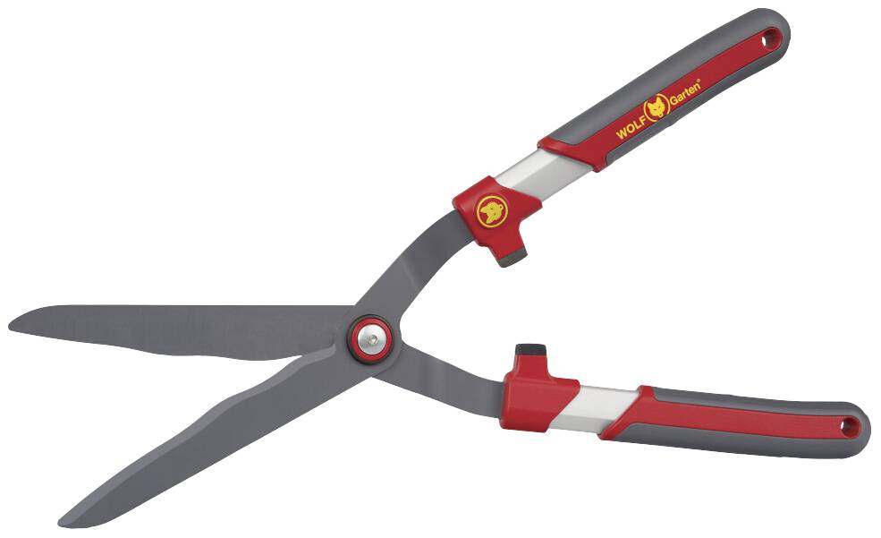 Nožnice na živý plot s červenými rúčkami, vhodné na strihanie kríkov a plotov.