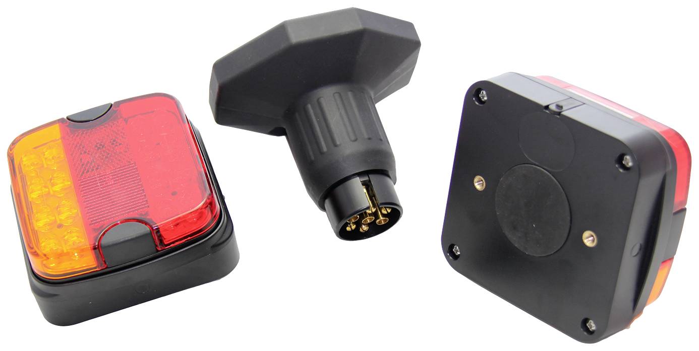 'Tri časti magnetickej sady prívesku: dva štvoruholníkové zadné svetlá a adaptérová zástrčka. Zadné svetlá sú červené a žlté.'