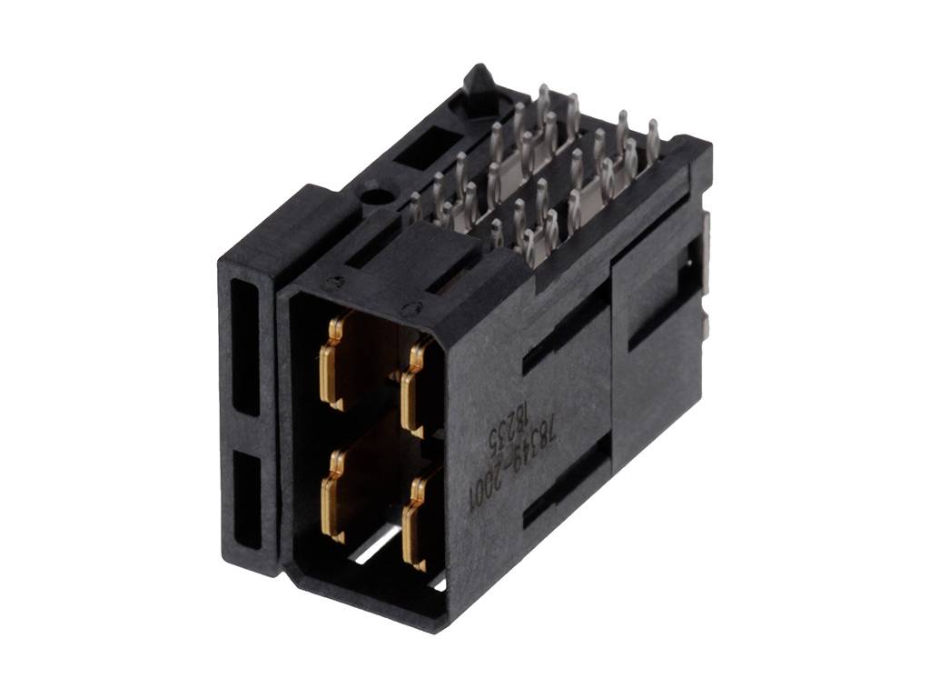 Čierny konektor s viacerými kovovými kolíkmi, vhodný pre elektronické pripojenia.