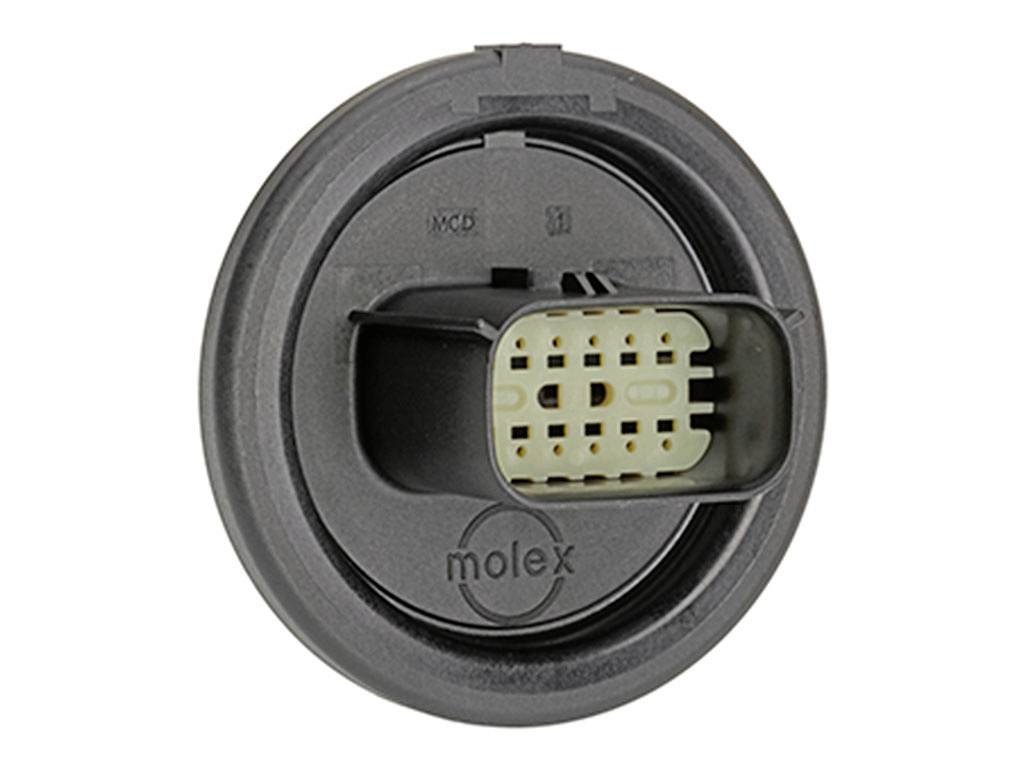 Elektronický guľatý konektor s viacerými malými obdĺžnikovými pripojovacími otvormi, označený ako 'molex'.