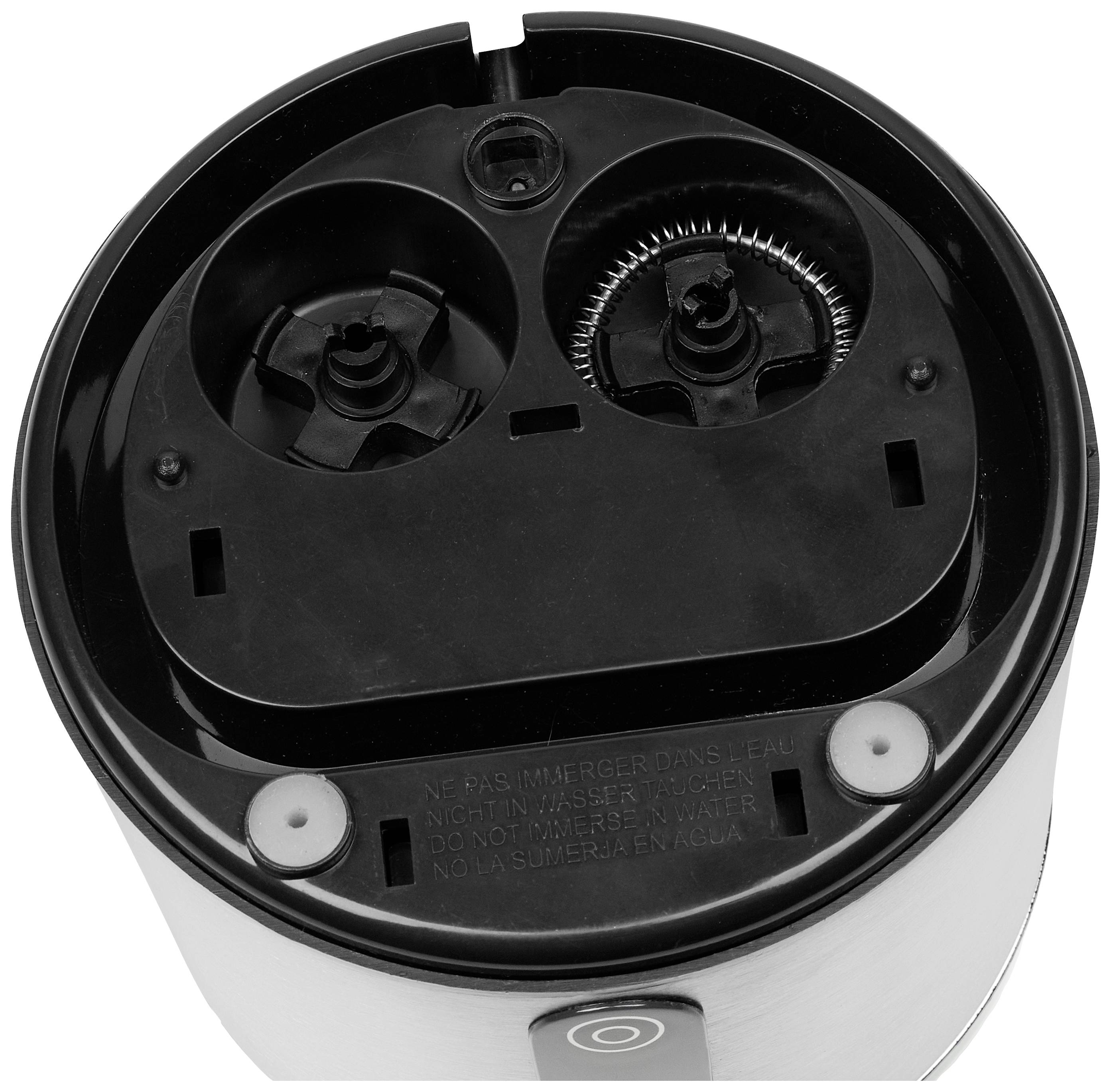 Spodný pohľad na elektrický holiaci strojček s dvoma rotujúcimi čepeľami. Pokyny na otvorenie a výstražný nápis: 'Neponárať do vody'.