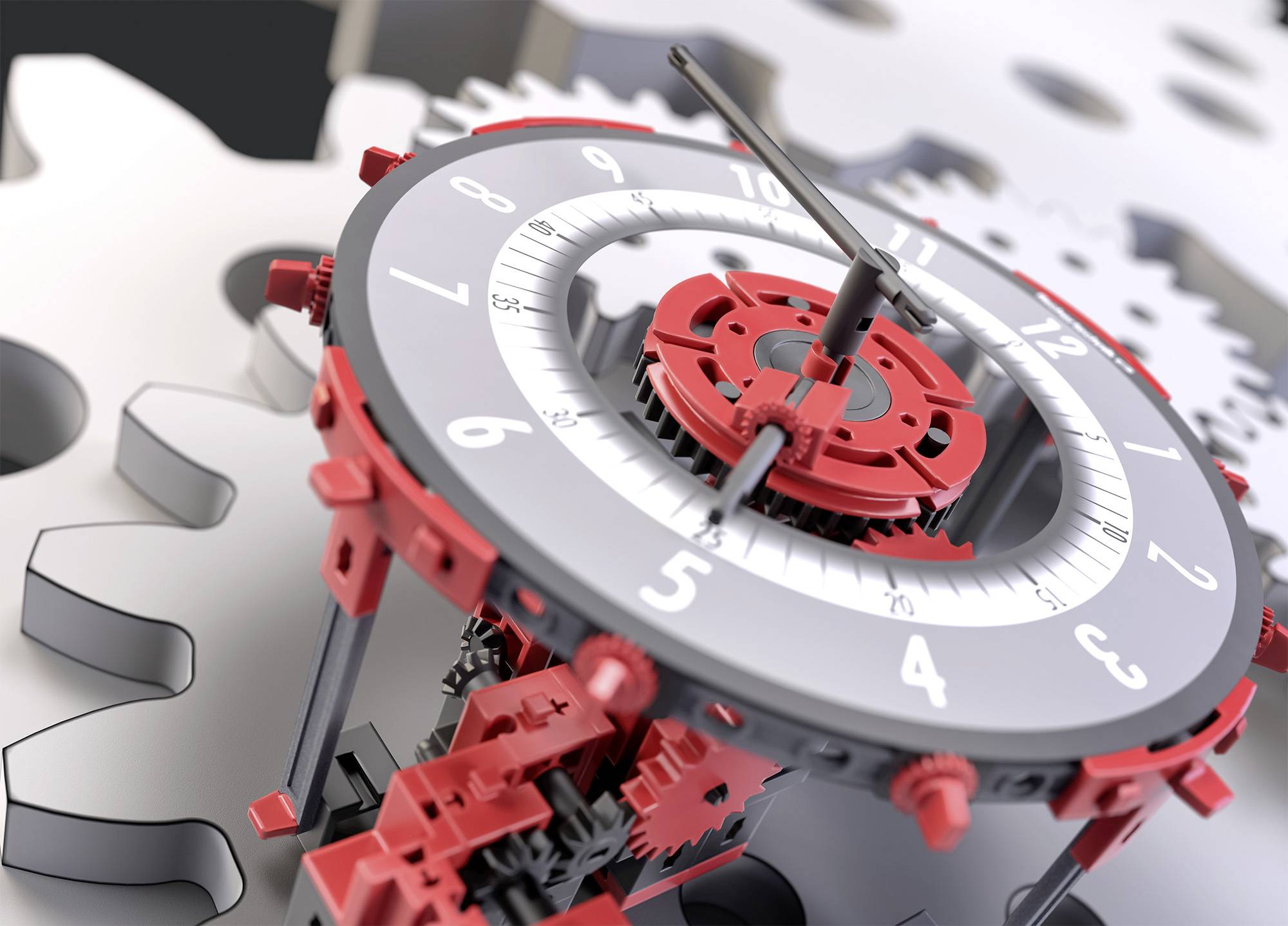 Mechanický hodinový strojček s červeno-čiernymi ozubenými kolesami a kruhovým ciferníkom znázorňuje pohybujúce sa ozubené kolesá a ručičky.