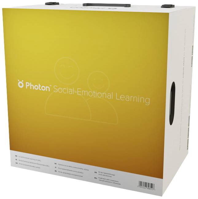 Kartónová škatuľa s nápisom 'Photon Sociálno-emocionálne vzdelávanie', na ktorej sú schematické kresby dvoch usmievajúcich sa tvárí.