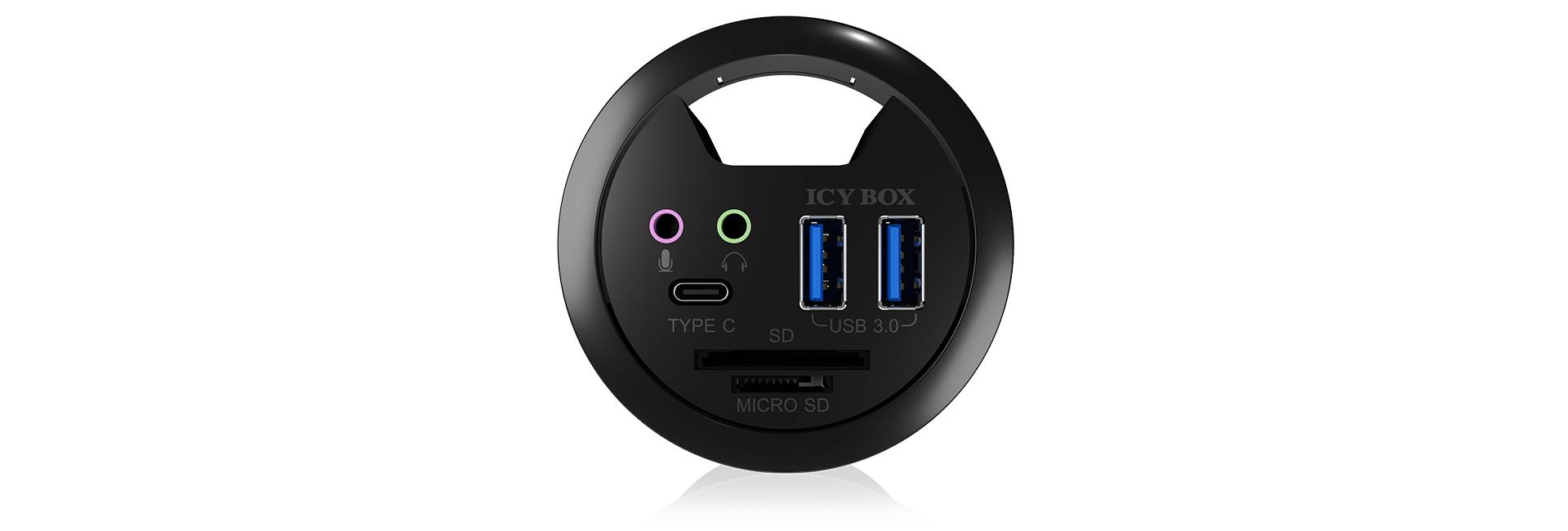 Okrúhla rozvodná krabica s dvoma USB 3.0 portami, jedným USB-C portom, audio konektormi a čítačkou mikro SD kariet.