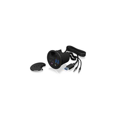 Okrúhly stolový adaptér s USB portom, audio vstupmi a výstupmi a odnímateľným krytom. Súčasťou balenia sú USB a audio káble.