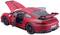 Červený model športového automobilu s otvorenými dverami a kapotou motora, interiér je viditeľný.
