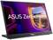 Mobilný monitor ASUS ZenScreen, zobrazujúci mestské svetlá cez okno lietadla. Hlavná charakteristika: veľká prenosnosť a jasný displej.