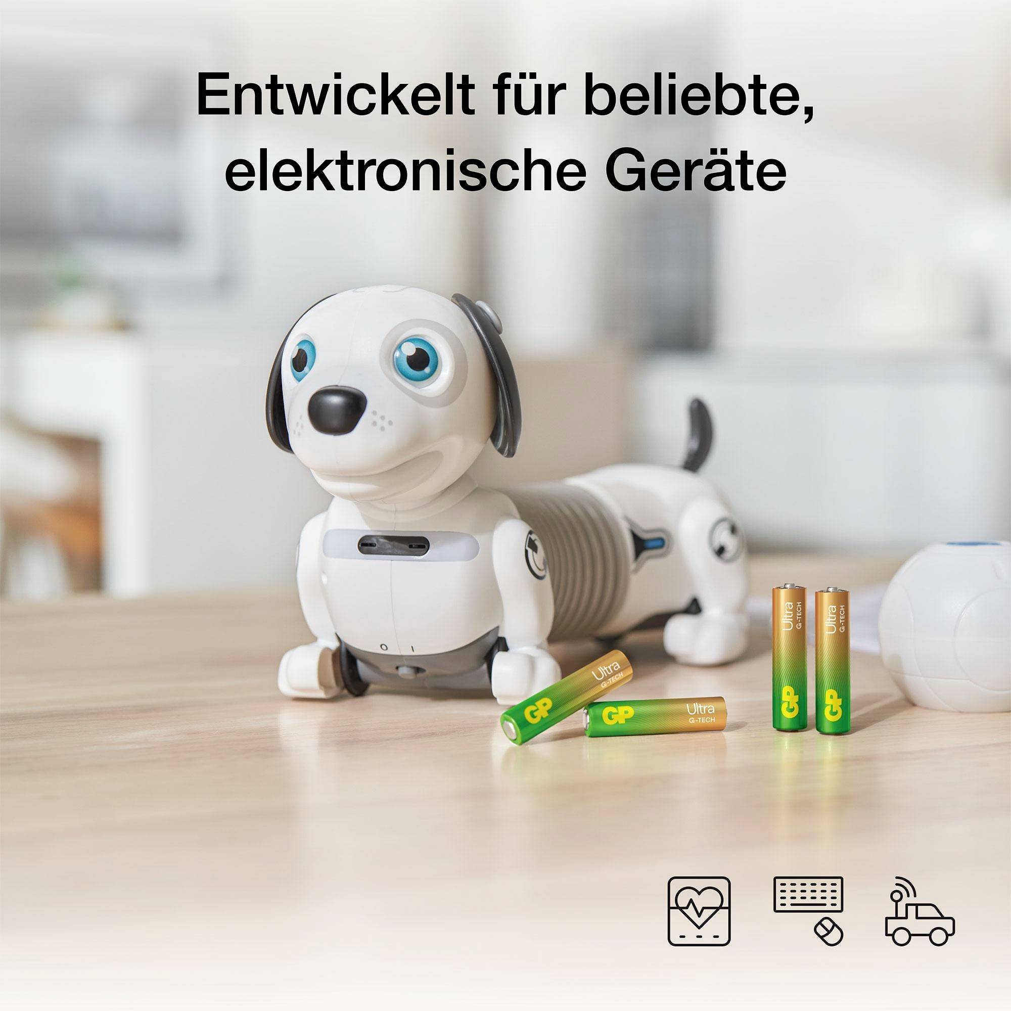 Hračka-robotický pes s batériami; hore je napísané "Vyvinuté pre obľúbené elektronické zariadenia".