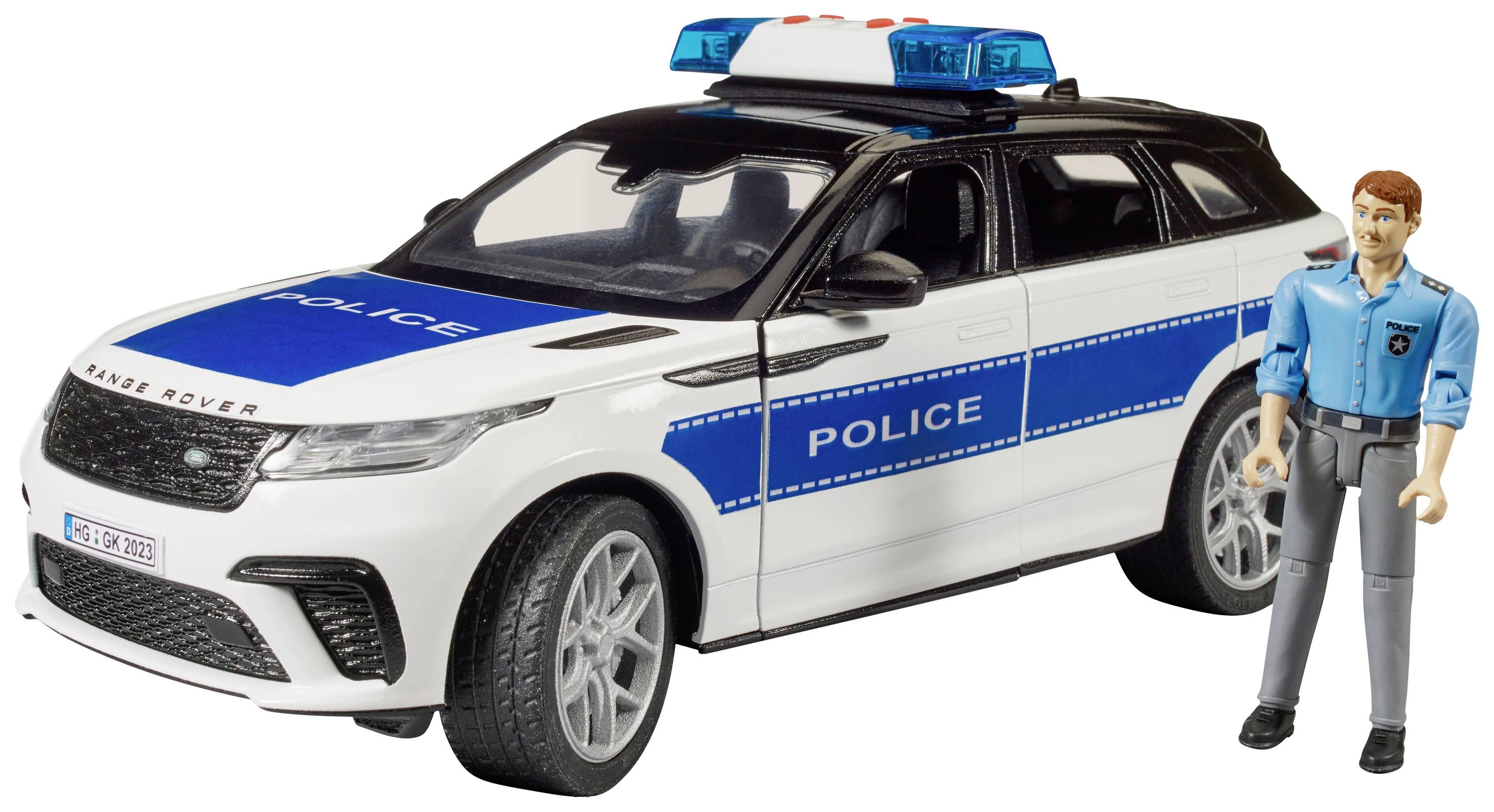 Hračkárske policajné auto s modrými pruhmi a nápisom 'POLICE'. Vedľa stojí figúrka v uniforme.