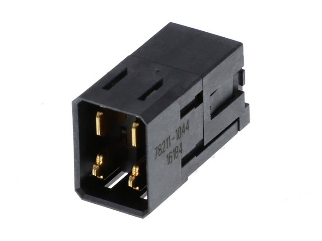 Čierny elektronický konektor so šiestimi zlatými kontaktmi. Má obdĺžnikový tvar a vytlačené číslo.