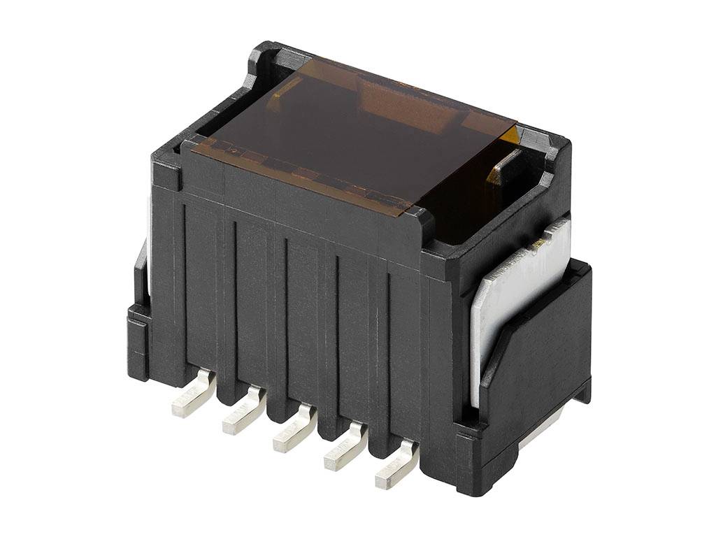 Čierna elektronická súčiastka so šiestimi kovovými kolíkmi na spodnej strane a plochým, priehľadným povrchom.