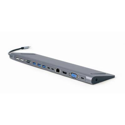 Sivý USB-C hub s viacerými portmi vrátane USB-A, USB-C, HDMI, VGA, Ethernet a čítačky SD kariet leží na bielom pozadí.