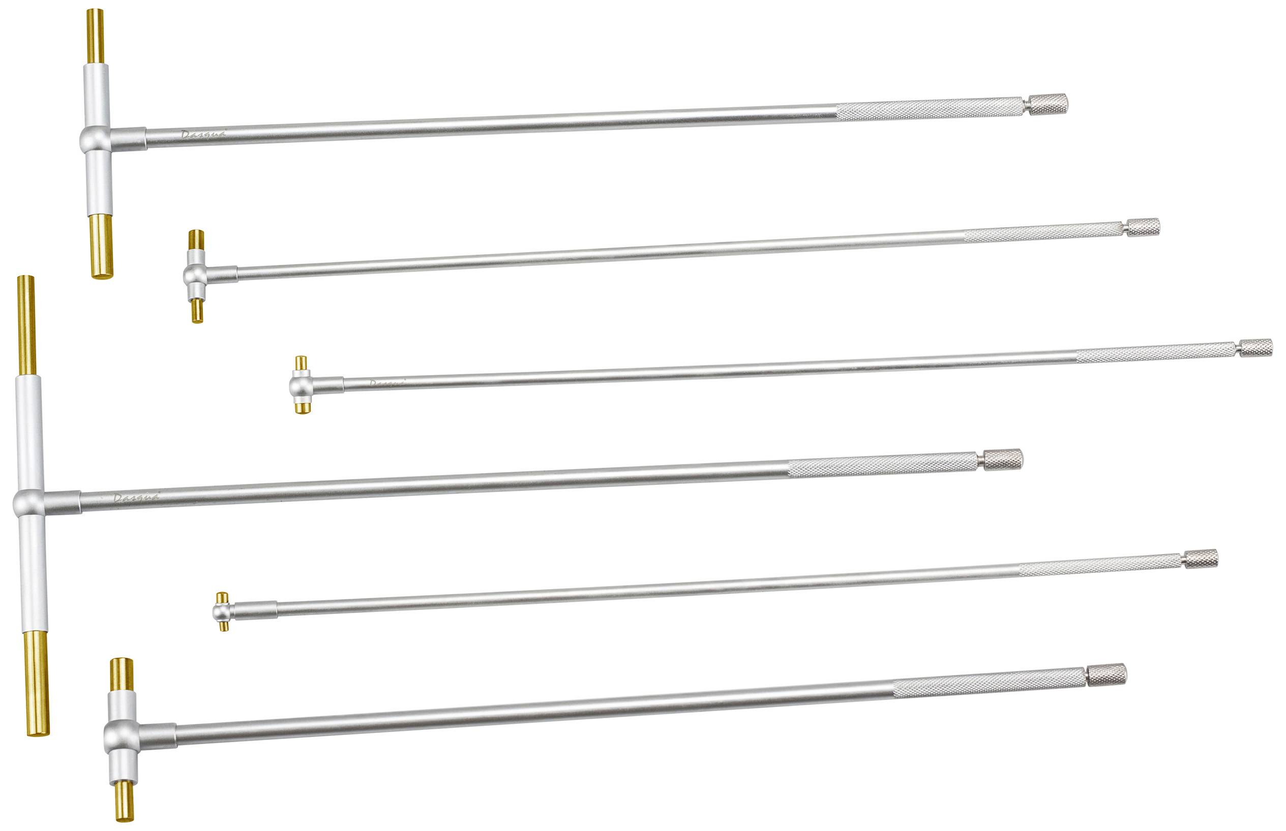 Šesť rôzne dlhých strieborných a zlatých momentových kľúčov, uložených vedľa seba rovnobežne, na bielom pozadí.