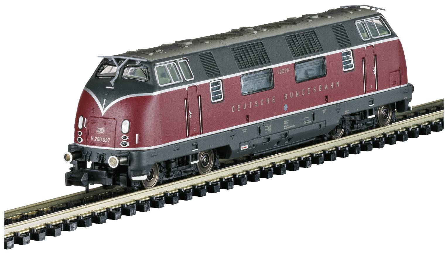 Model vlaku Nemeckých spolkových dráh, séria V 200, v červenom a čiernom laku na železničnej trati.