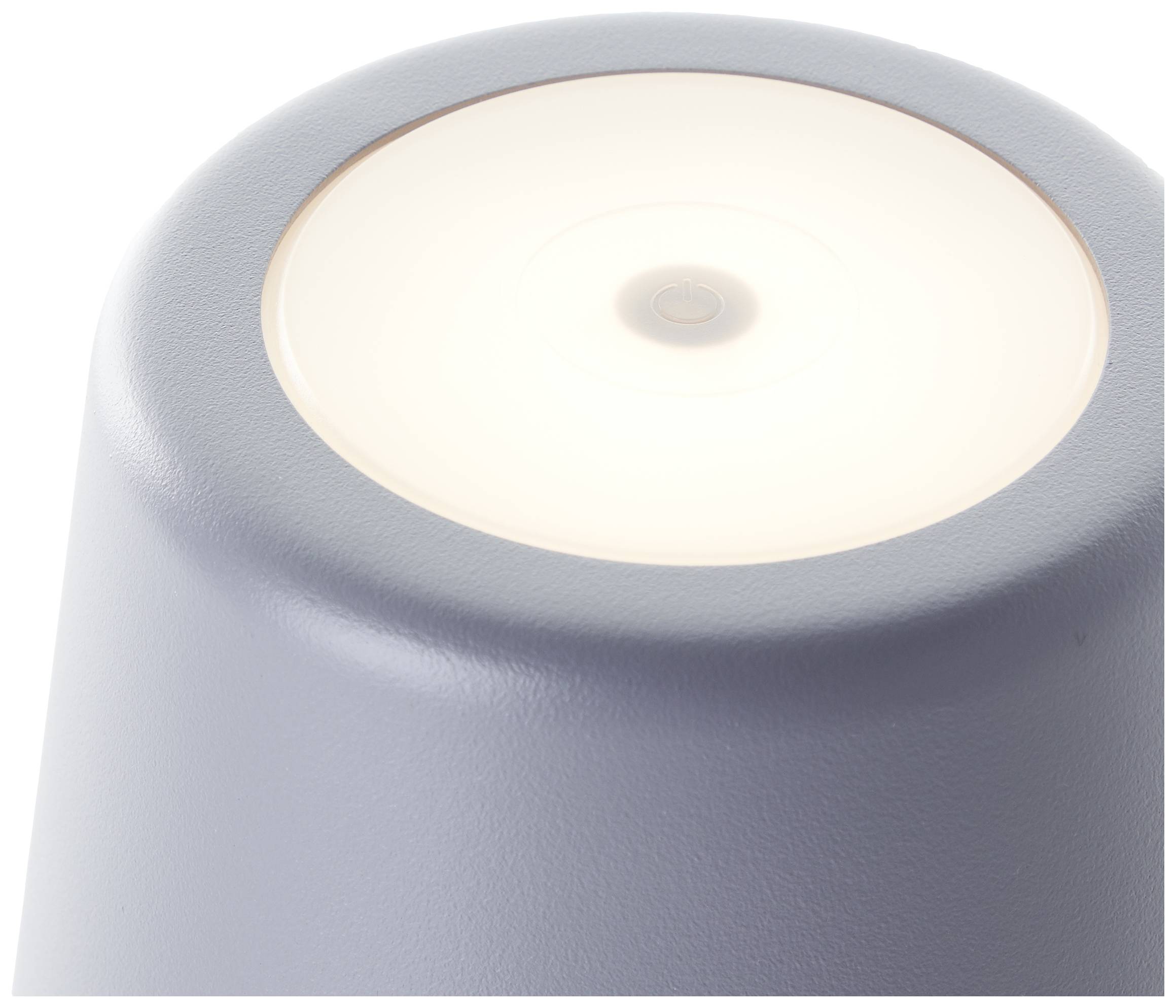 Sivá stolná lampa v minimalistickom dizajne, ktorá jemne svieti zhora.