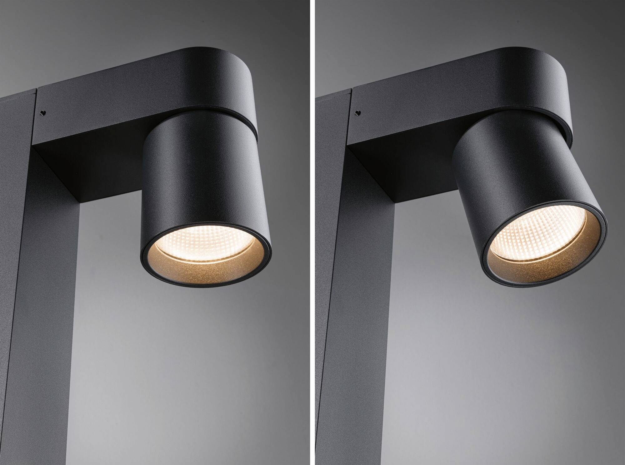 Dva moderné, čierne stropné reflektory svietia rôznymi smermi. Sú navrhnuté v minimalistickom štýle.