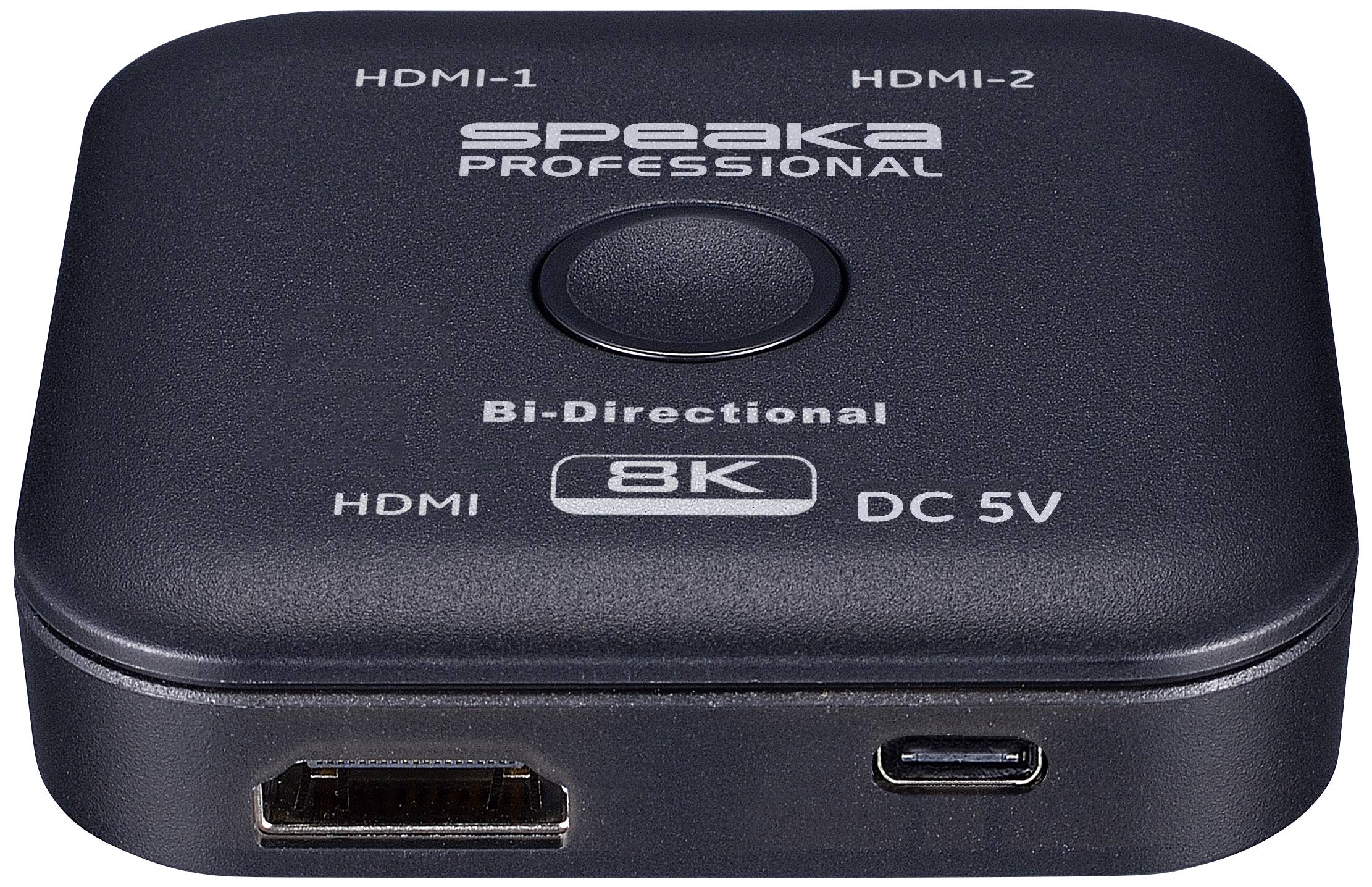 Čierny HDMI splitter s nápisom 'Speaka Professional' a '8K Bi-Directional'. Dva HDMI porty na hornej strane, jeden HDMI vstup a jeden DC 5V port vpredu.