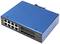 Modrý sieťový switch s dvanástimi ethernetovými portami a štyrmi optickými portami na bielom povrchu.