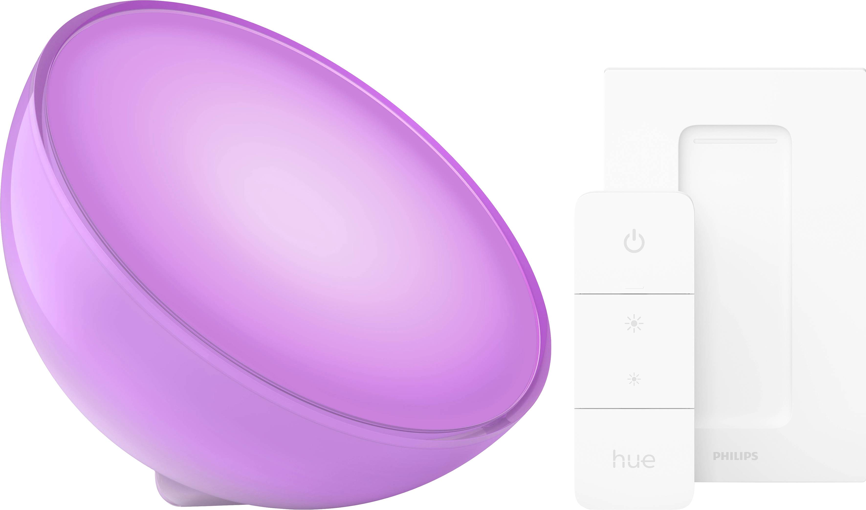 Ružové svetielkujúce, okrúhle svetlo Philips Hue vedľa bielej ovládač s dvomi tlačidlami na ovládanie jasu.
