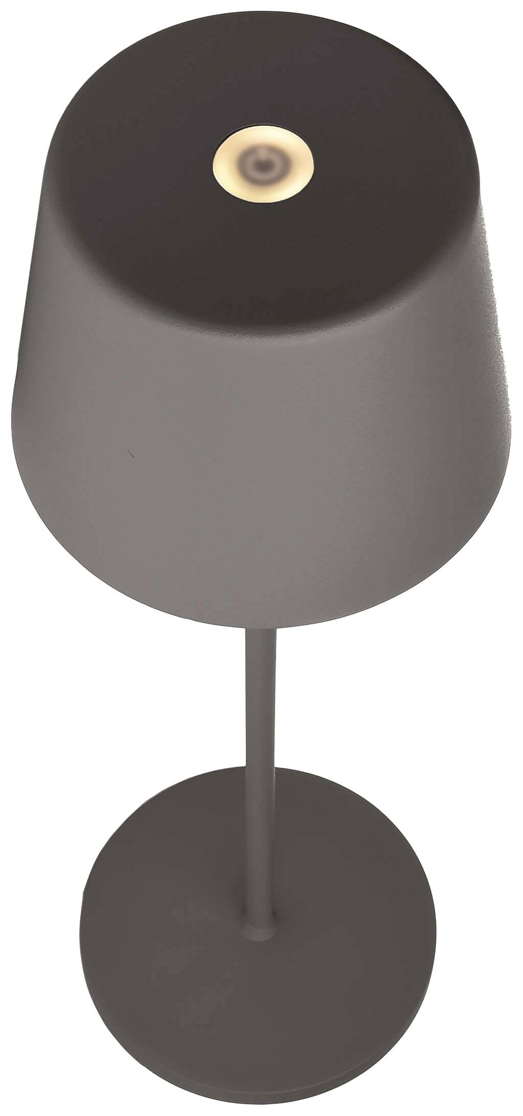 Stolová lampa s okrúhlym tienidlom a kovovým stojanom, ktorá vyžaruje teplé svetlo cez horný otvor.