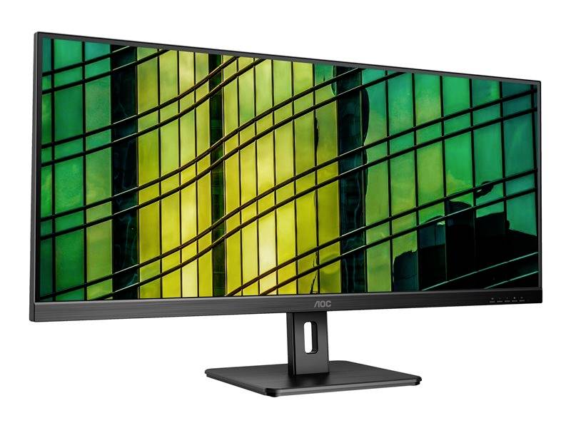 Počítačový monitor s abstraktným, farebným pozadím pozostávajúcim z zelených a žltých sklenených okien a kľukatých línií.