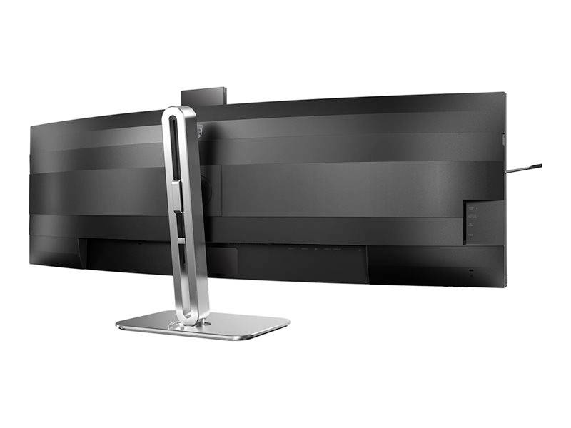 Široký, zakrivený počítačový monitor zozadu, s elegantným strieborným stojanom.