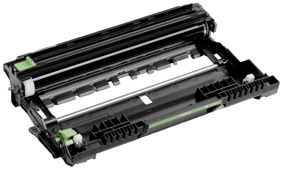 Prázdny toner tlačiarne ležiaci horizontálne na bielom povrchu, pozostávajúci zo zelených a čiernych komponentov.