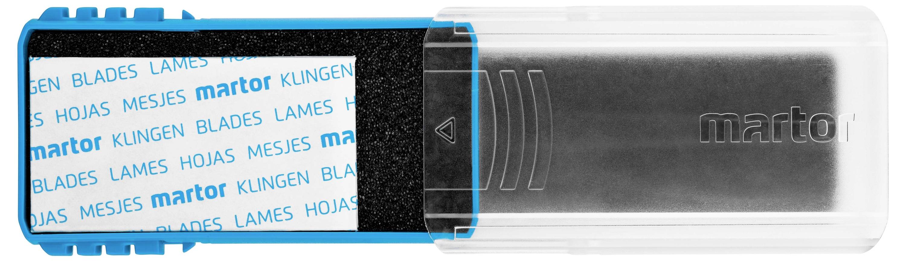 Modrobiely kontajner na čepele s nápisom 'martor' vo viacerých jazykoch. Vpravo transparentný obal.