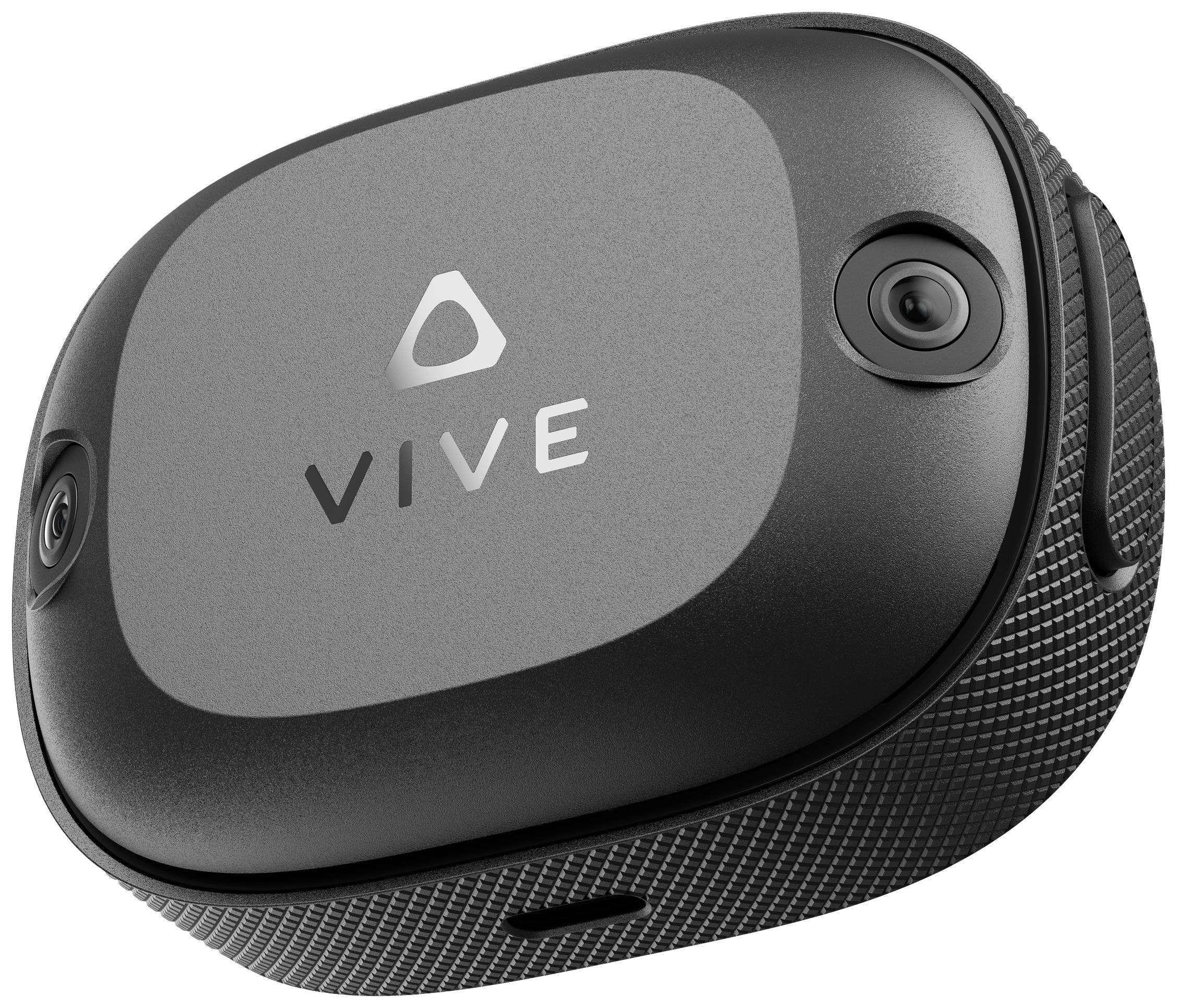 Čierne, obdĺžnikové VR headset s logom 'VIVE' uprostred. Dva objektívy kamier sú viditeľné v rohoch zariadenia.