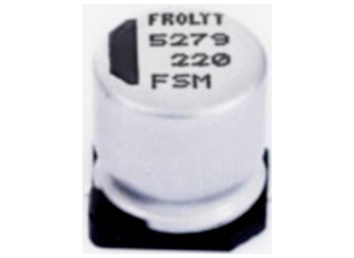 Strieborný elektrolytický kondenzátor s nápisom „FROLYT 5279 220 FSM", namontovaný na doske plošného spoja.