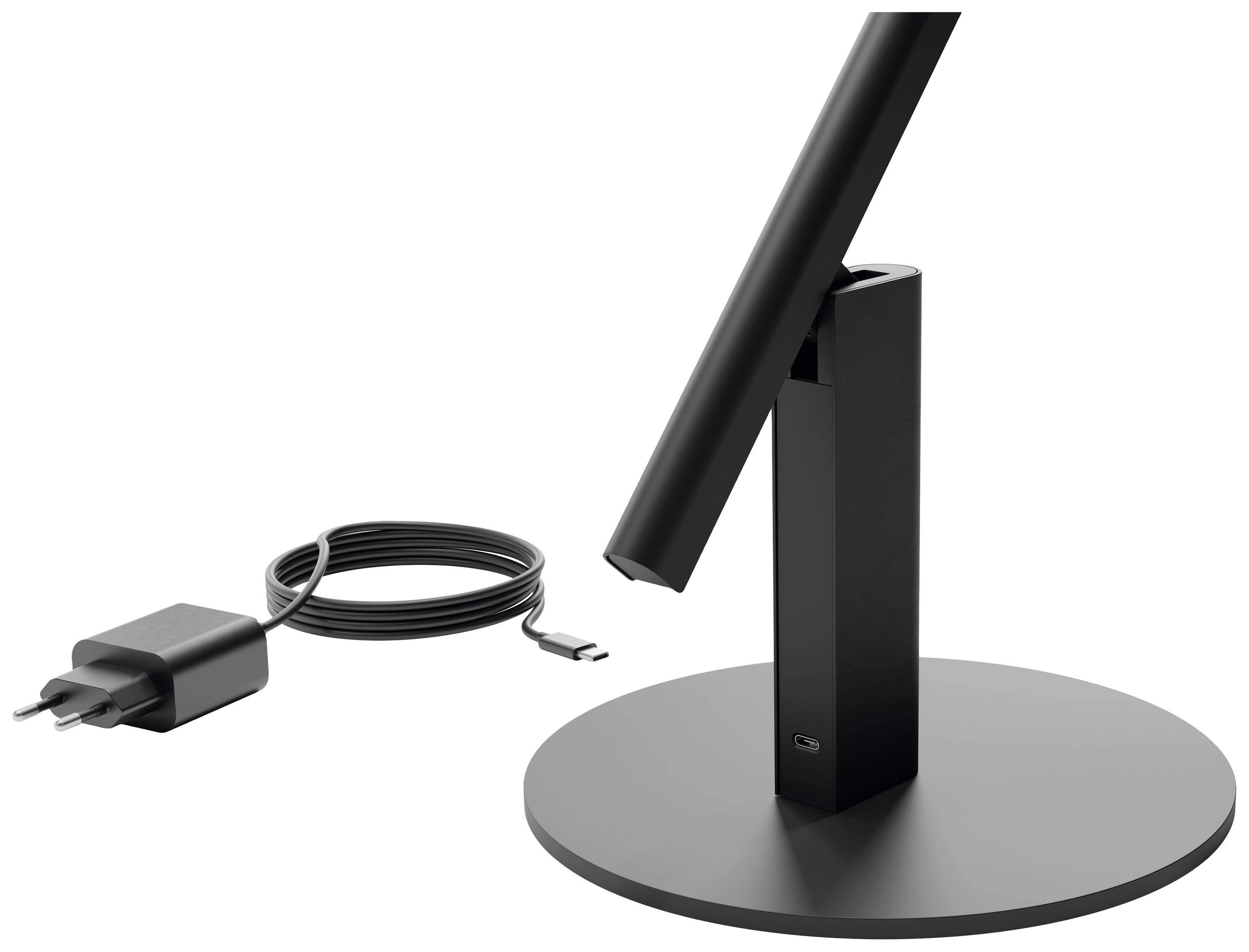 Čierny stojan na stolnú lampu s valcovitou základňou, vedľa neho čierny USB nabíjací kábel s adaptérom.
