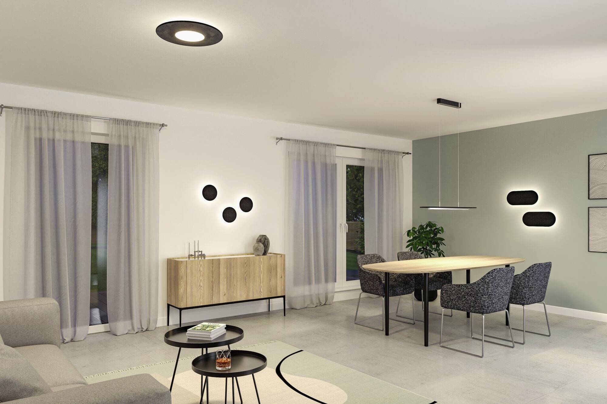 Moderný obytný a jedálenský priestor so sivou sedačkou, jedálenským stolom so štyrmi stoličkami, minimalistickou dekoráciou a jemným osvetlením.