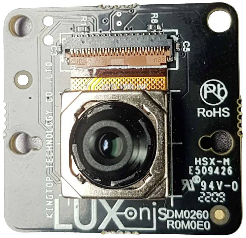 Kamera-modul dosky 'Luxonis' zobrazuje objektív a elektronické obvody. Obsahuje výrobné informácie a kódy komponentov.