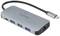 Strieborný USB-C hub s viacerými portami: tri USB porty, sieťový kábel a HDMI výstup. Ideálny pre pripojenie viacerých zariadení.