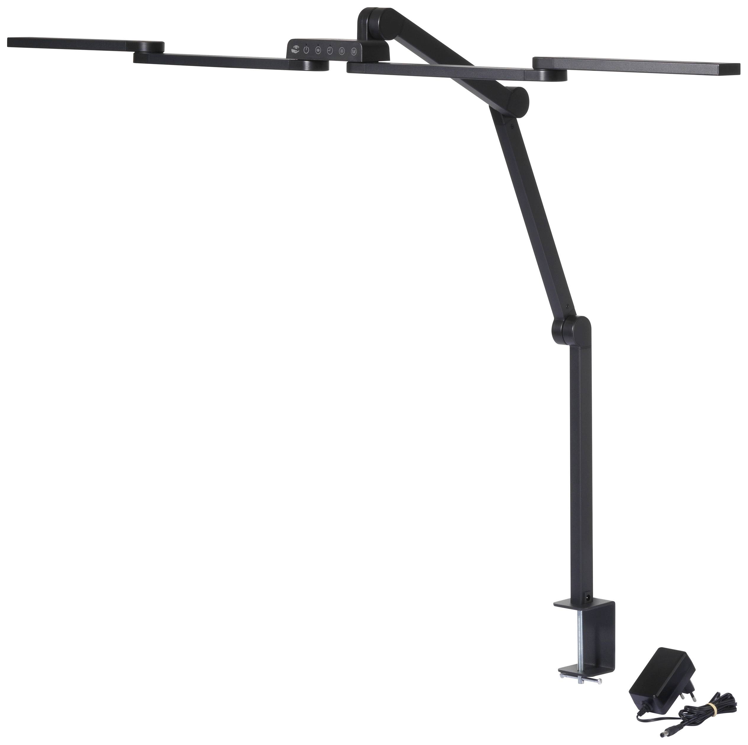 Čierna stolová lampa s nastaviteľným ramenom, ktorá sa upevňuje pomocou svorky na stôl. Napájací zdroj a kábel sú viditeľné vedľa lampy.
