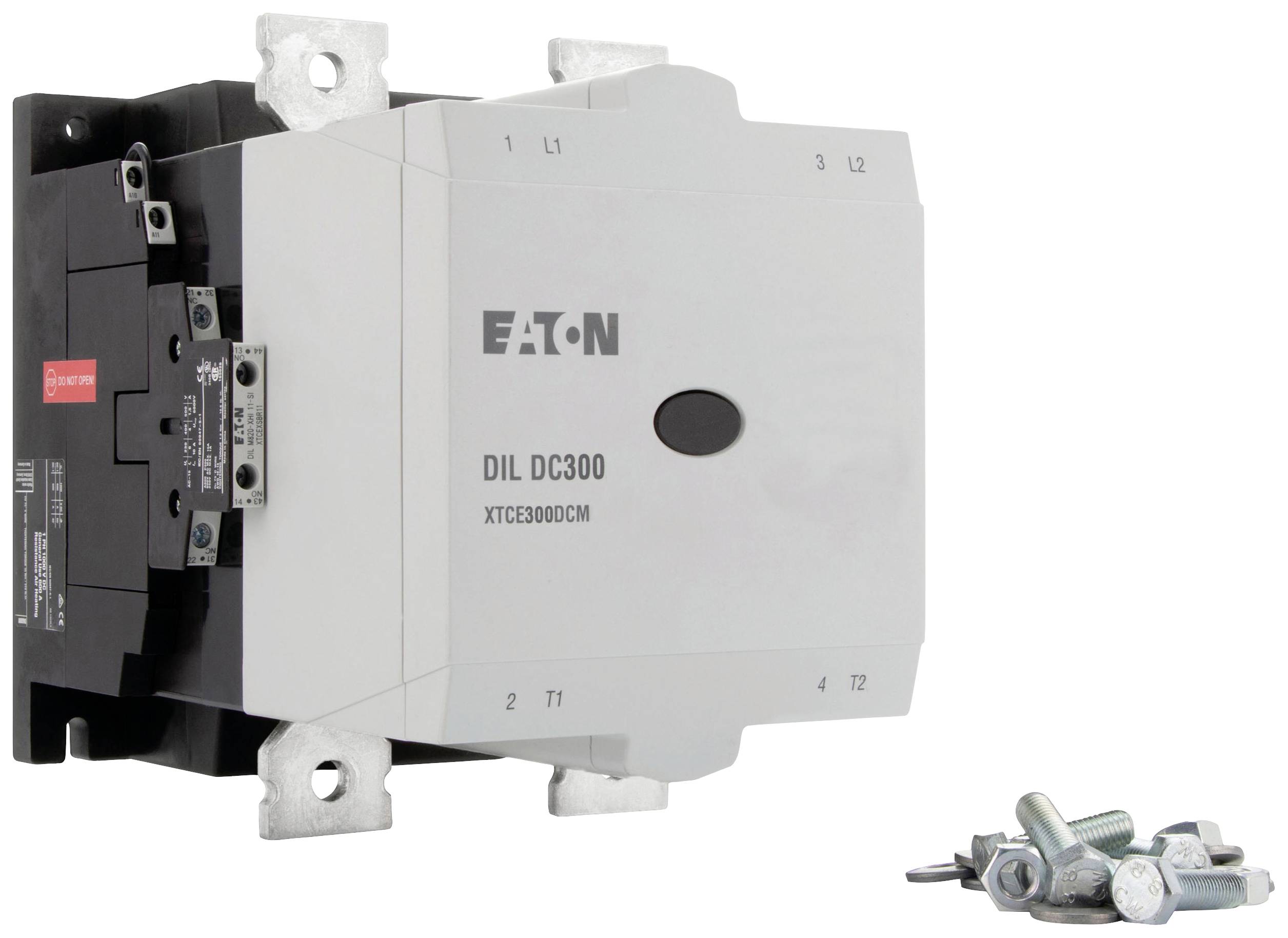 Elektrický stykač značky Eaton, model DIL DC300, s pripojovaciou svorkovnicou, vedľa ktorého leží montážny materiál ako skrutky a matice.
