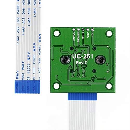 'Zelená doska plošných spojov UC-261 Rev.D s pripojeným plochým káblom, pohľad zozadu zobrazuje elektrické obvody a montážne skrutky.'