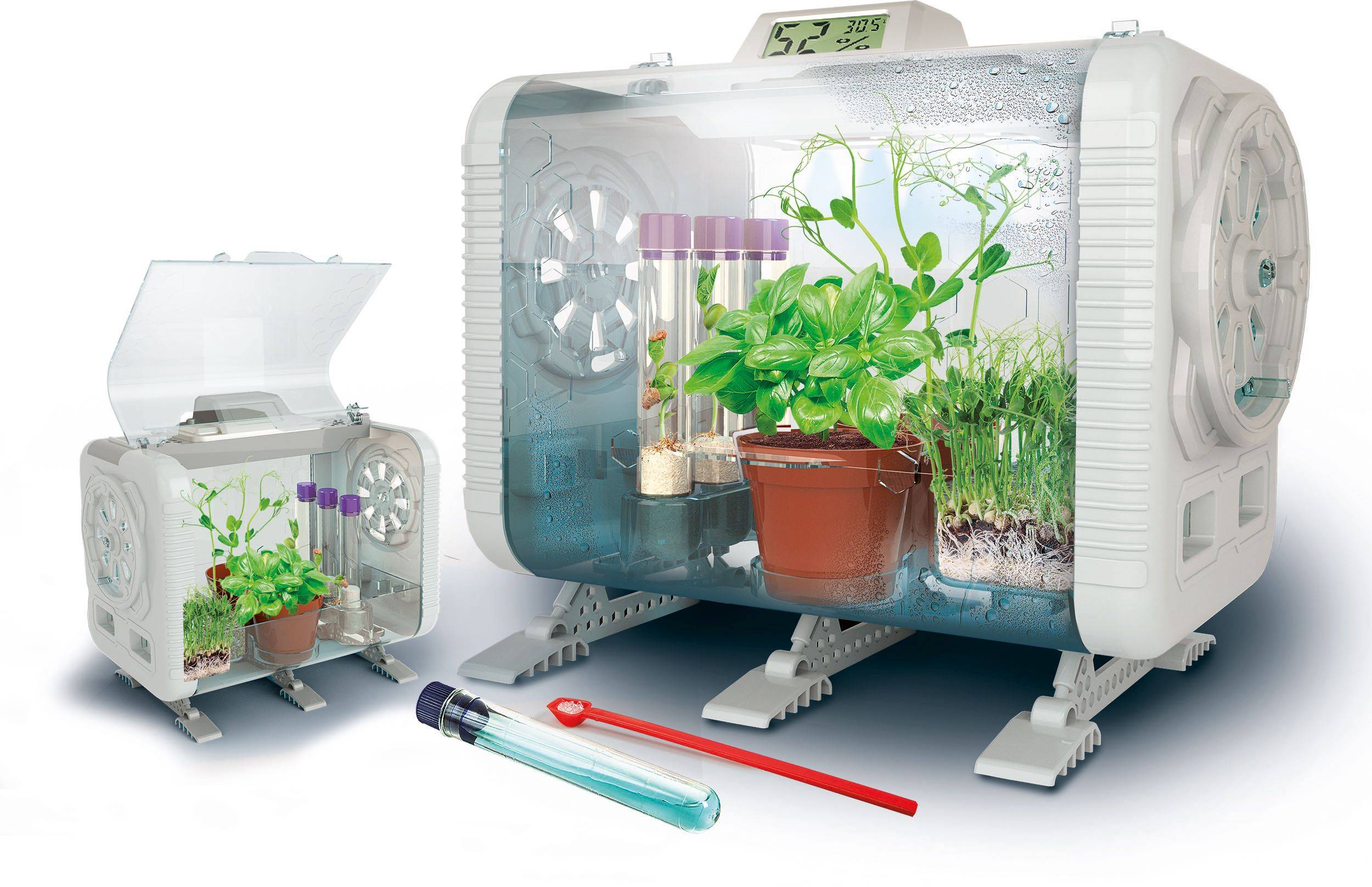 Prenosný skleník s digitálnymi displejmi, obsahuje rastliny v kvetináčoch, skúmavky a systém zavlažovania. Slúži na zobrazovanie experimentov rastu.