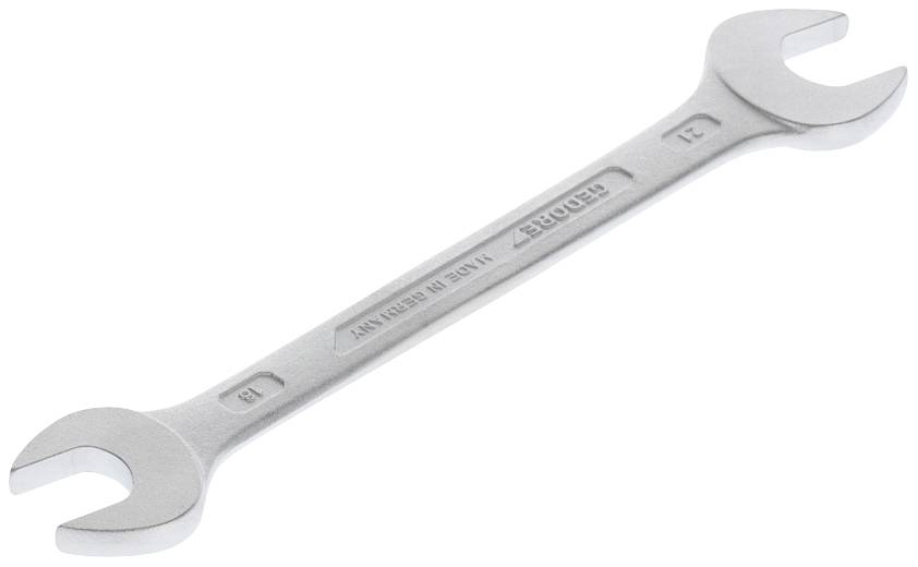 Strieborný obojstranný kľúč s veľkosťami 21 a 23 mm na bielom pozadí.